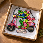 Personalized frog couple scooter suncatcher packed in a Pixiwoo gift box with tissue paper