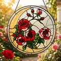 Stained glass panel with red and pink roses in a garden setting