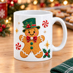 White Christmas mug with a gingerbread man in an emerald top hat and peppermints printed on the side