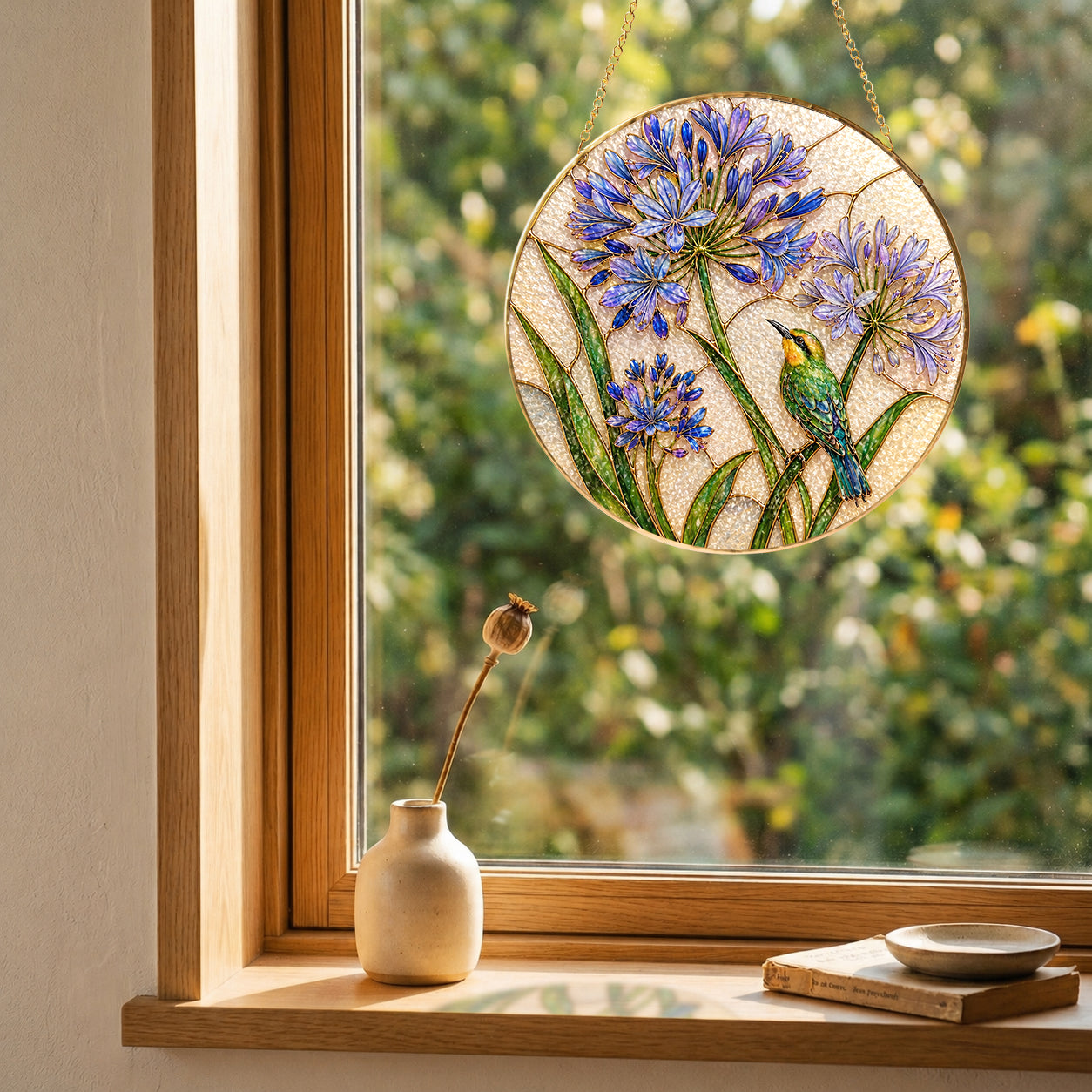 Agapanthus bird suncatcher in a bright window