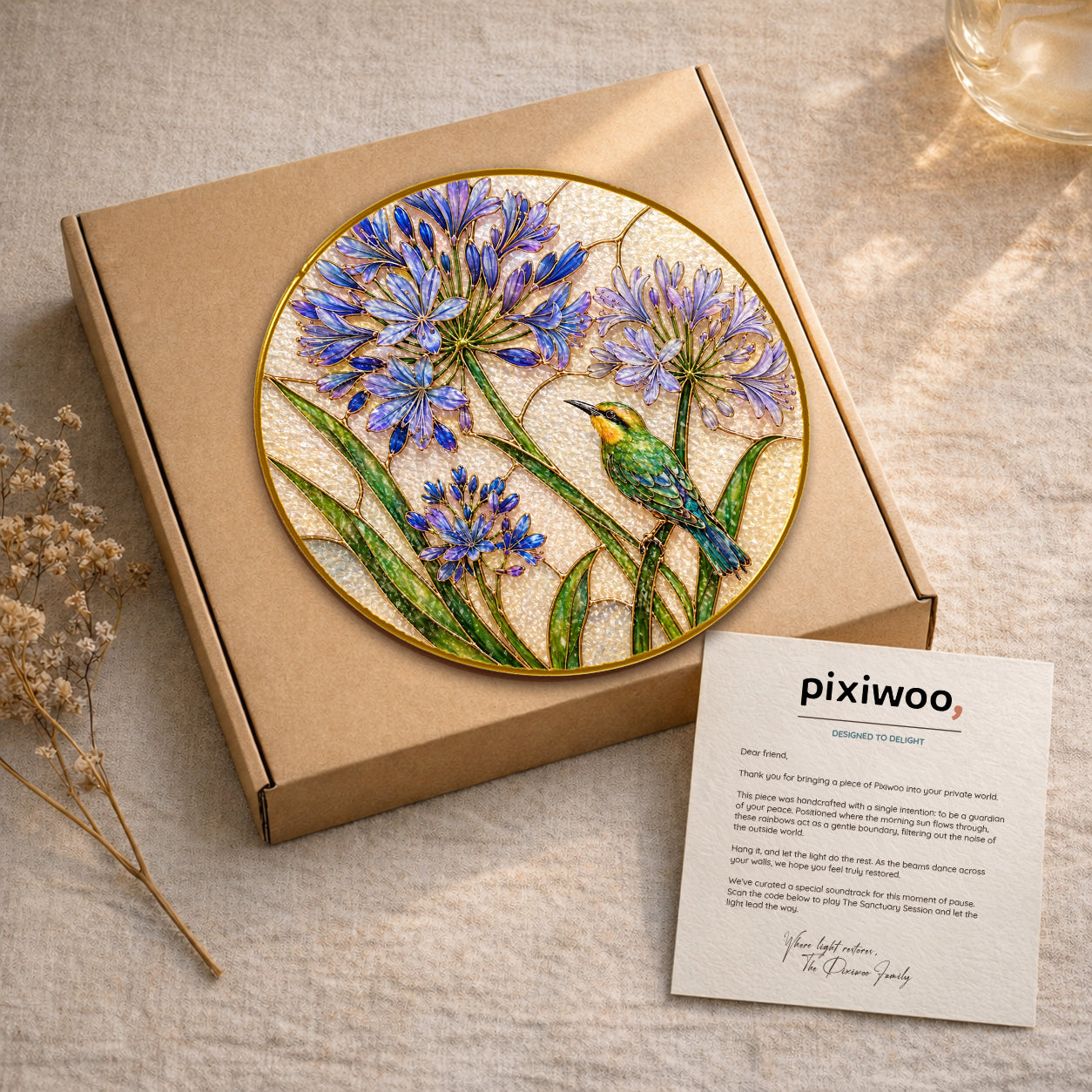 Agapanthus bird suncatcher on Pixiwoo gift packaging