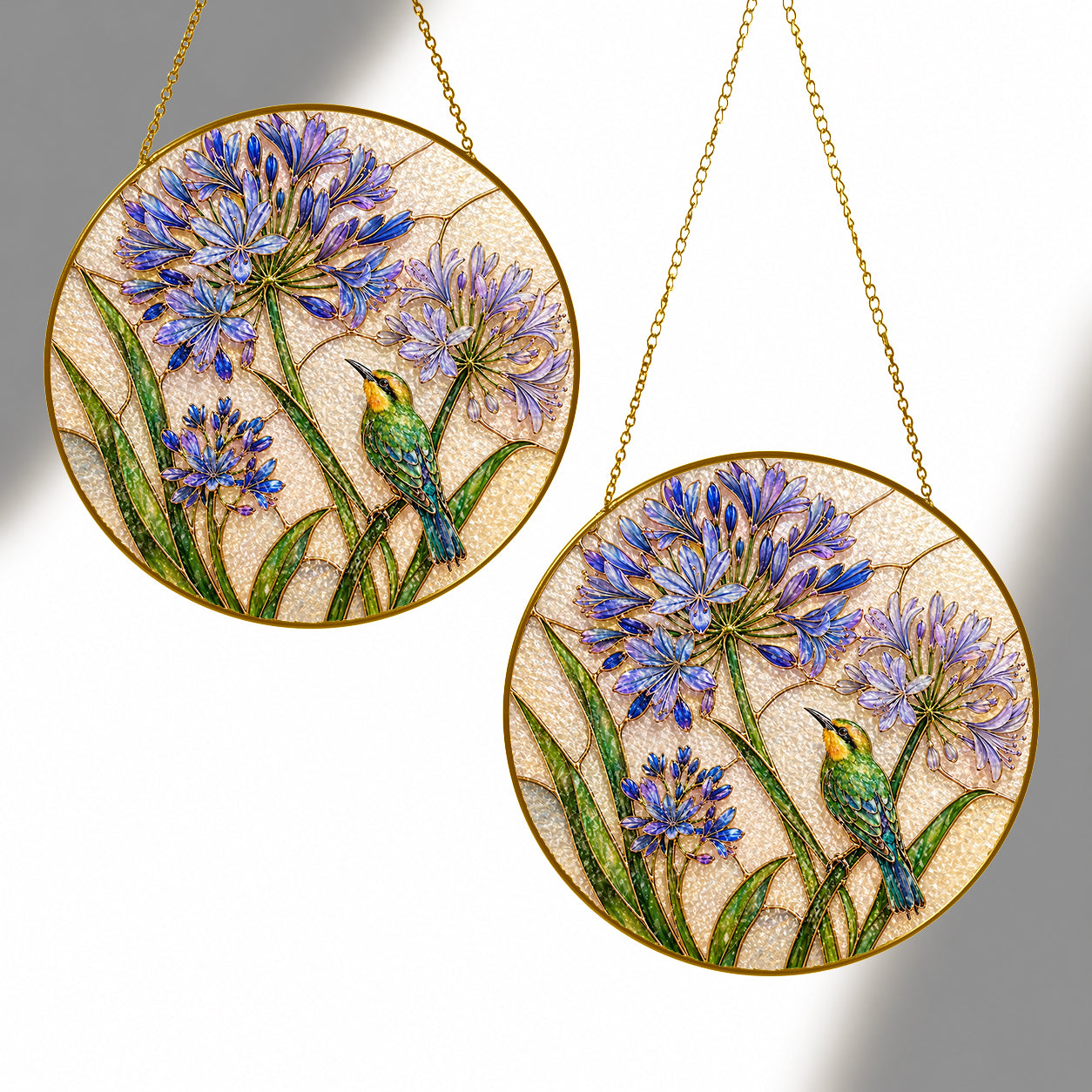 Agapanthus bird suncatcher shown in two sizes