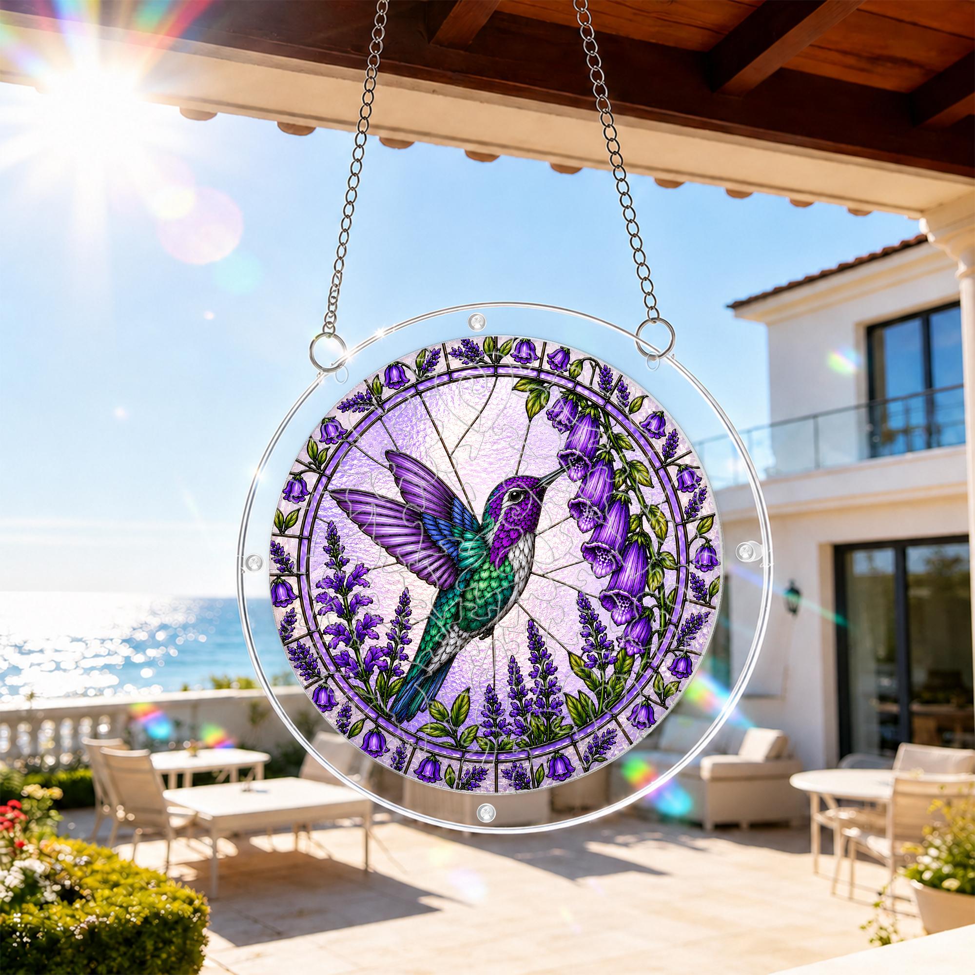 Purple hummingbird acrylic puzzle suncatcher hanging by a bright balcony window in natural sunlight.