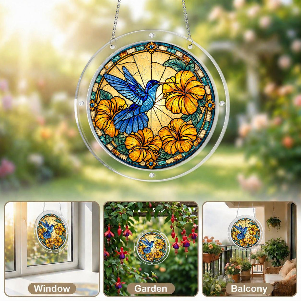 Blue hummingbird acrylic puzzle suncatcher displayed in a cozy wooden window corner with natural daylight.