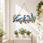 Blue birds on a branch holographic suncatcher displayed indoors as a nature-inspired window hanging