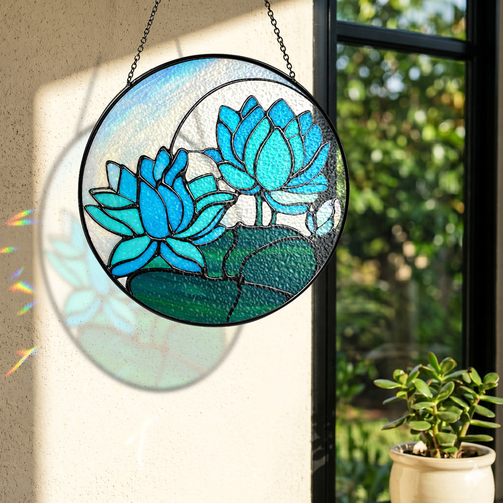 Blue lotus suncatcher near a window with colorful light reflection on the wall