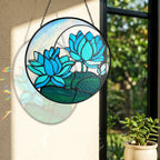 Blue lotus suncatcher near a window with colorful light reflection on the wall