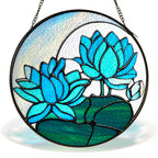 Blue lotus stained glass suncatcher with crescent moon and black frame on a white background