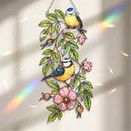 Blue tit and wild rose acrylic suncatcher hanging in a sunlit window as home decor