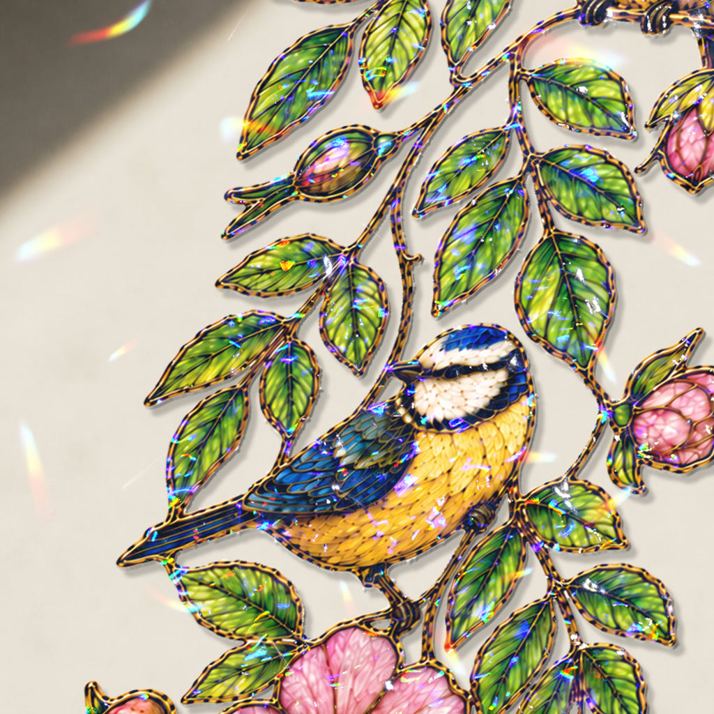 Double-sided blue tit and wild rose holographic acrylic suncatcher glowing in natural light