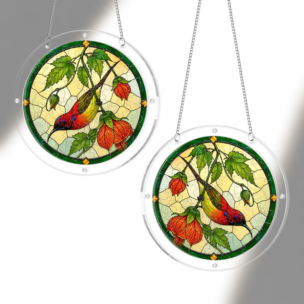 Two cardinal orange lantern flower acrylic puzzle suncatchers hanging together with clear acrylic frames
