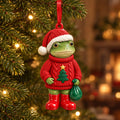 Red Sweater frog ceramic Christmas ornament: frog in a red knit sweater with a little tree on it, Santa hat and green gift bag, hanging on a Christmas tree