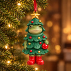 Christmas Tree frog ceramic ornament: frog dressed as a Christmas tree with a gold star on top and a red bauble, hanging on a tree