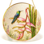 Hummingbird heliconia gold frame suncatcher in a sunny window