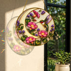Hummingbird pink flowers suncatcher with colorful light reflection