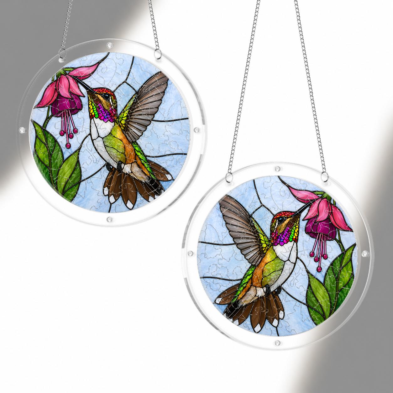 Two hummingbird pink fuchsia flower acrylic puzzle suncatchers hanging together to show different display sizes