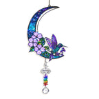 Hummingbird purple blossom holographic suncatcher in a window