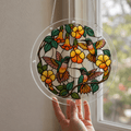 Hummingbird yellow flower acrylic puzzle suncatcher hanging by a window