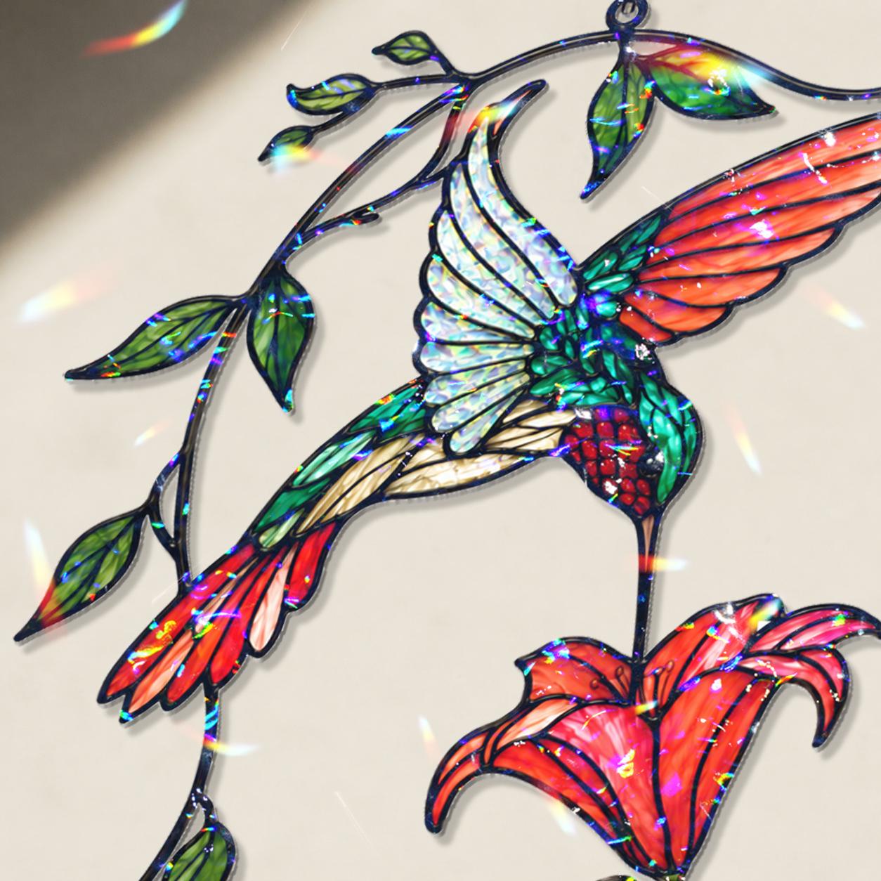 Close-up of hummingbird and red flower acrylic suncatcher showing broken glass hologram rainbow finish.