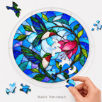 Hand assembling a hummingbird flower acrylic jigsaw puzzle suncatcher with colorful acrylic puzzle pieces