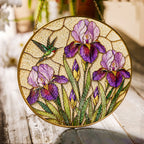 Iris and hummingbird stained glass suncatcher with gold frame on a white background