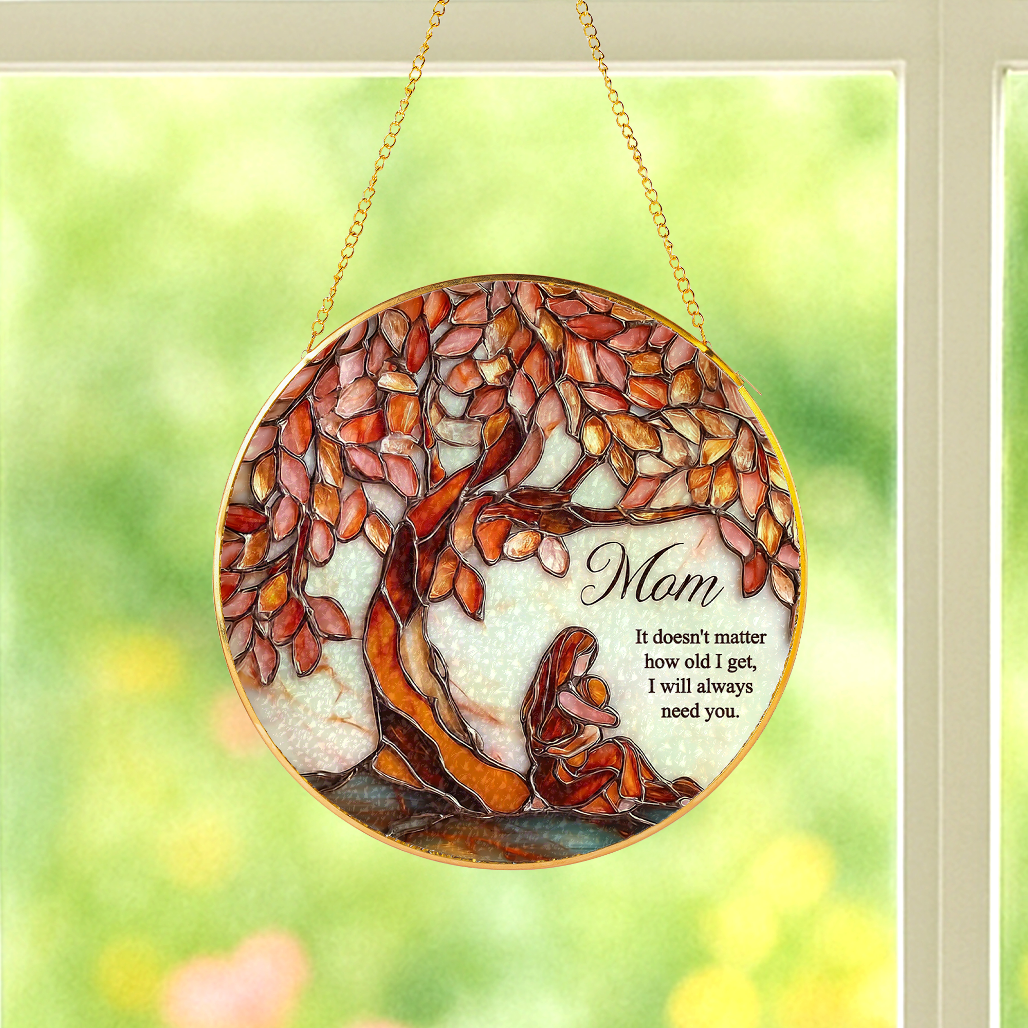 Mom Tree of Life stained glass window hanging creating warm sunlight reflections indoors