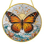 Monarch butterfly stained glass suncatcher held in hand