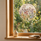 Nanny wildflower suncatcher in a bright window