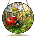 Ladybug on a white wild rose stained glass suncatcher