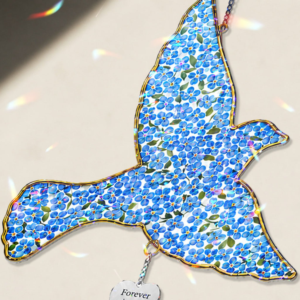 Personalized blue bird memorial crystal suncatcher in a window
