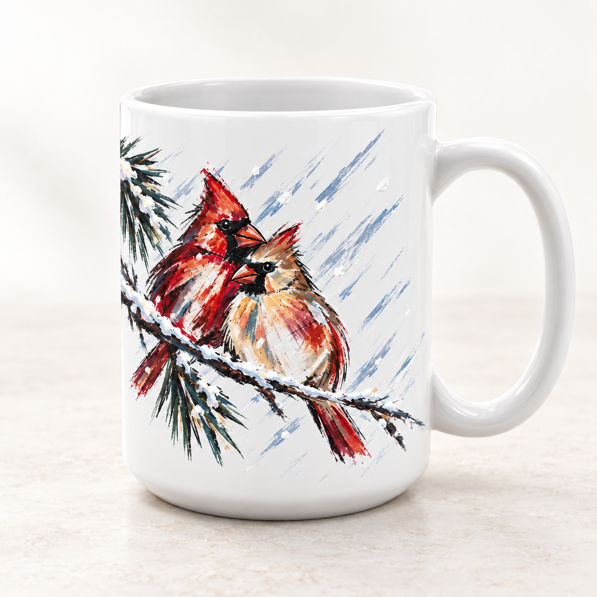 White ceramic mug with two watercolor cardinals perched on a snowy pine branch