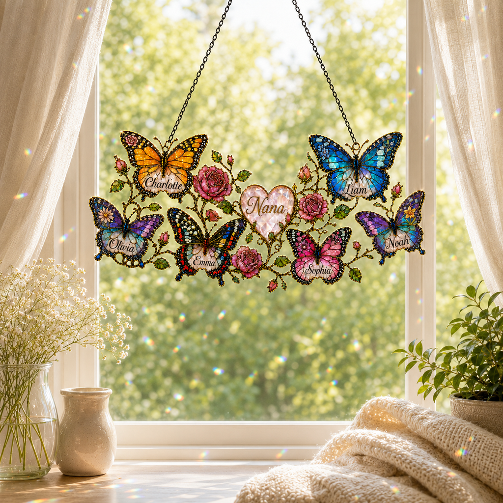 Personalized Nana butterfly suncatcher hanging in a bright window with rainbow reflections