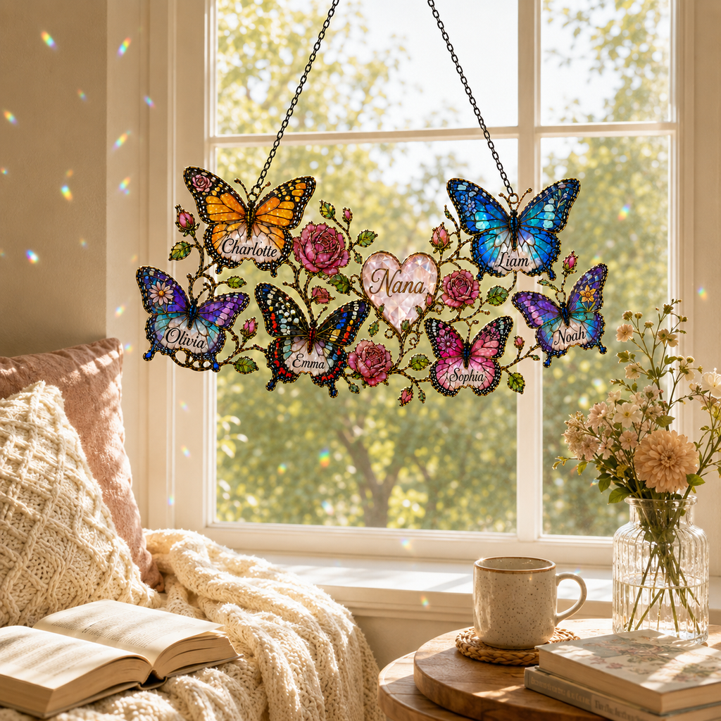 Personalized grandma butterfly and roses suncatcher above a cozy window seat with books and coffee