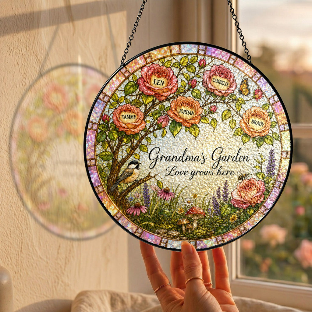 Hand holding the personalized Grandma's Garden rose tree suncatcher by a window
