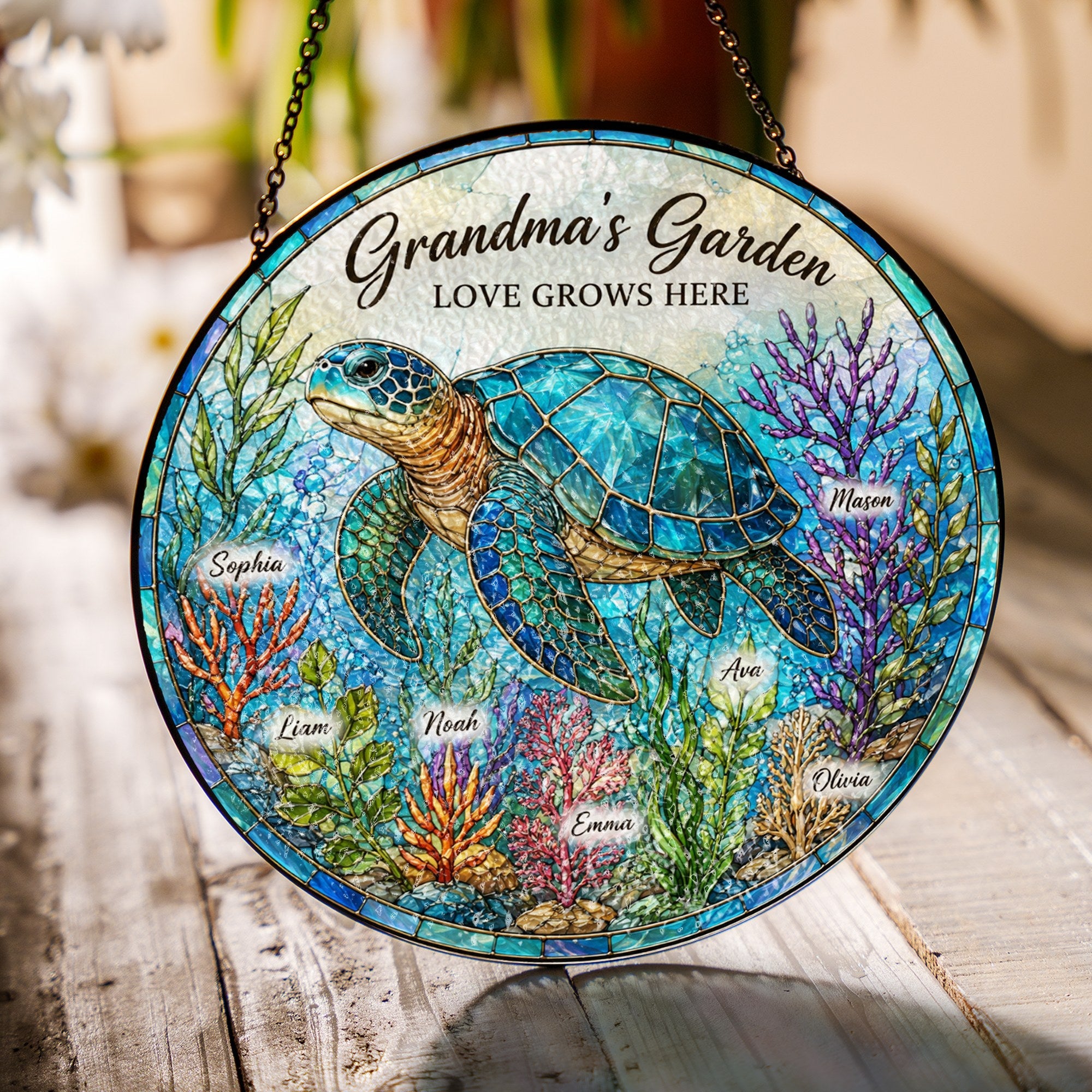 Grandma's Garden sea turtle suncatcher hanging in a sunny window casting rainbows