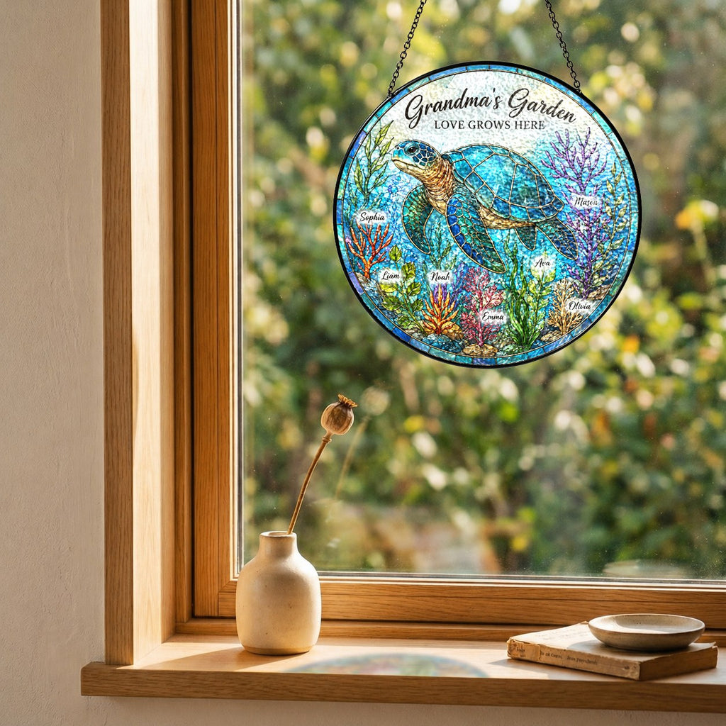 Sea turtle suncatcher with custom names hanging in a wooden window frame