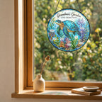 Sea turtle suncatcher with custom names hanging in a wooden window frame