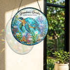 Grandma's Garden sea turtle suncatcher on a wall with rainbow sunlight
