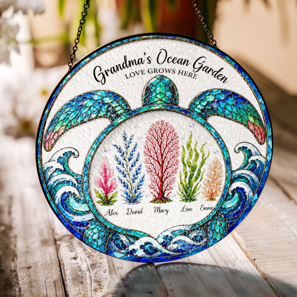 Turtle shaped ocean garden suncatcher hanging in a sunny window casting rainbows