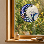 Hummingbird dogwood memorial suncatcher in a window