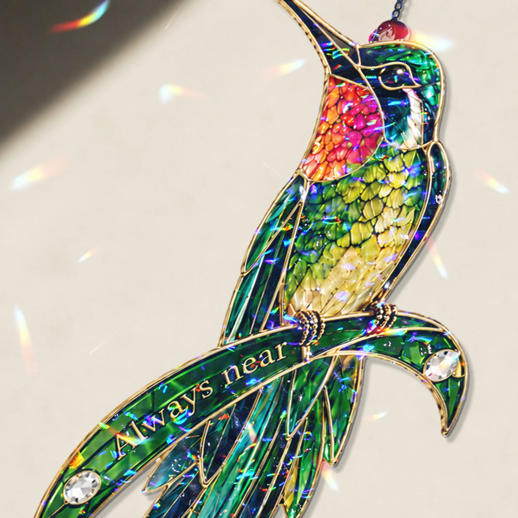 Personalized hummingbird memorial crystal suncatcher in a window