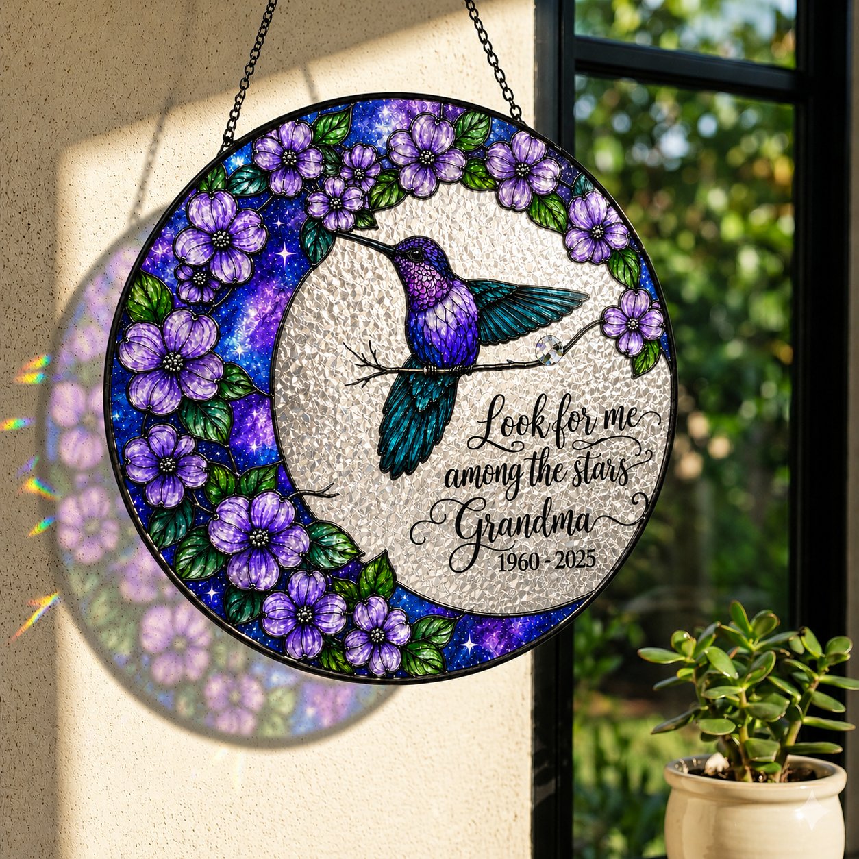 Hummingbird moon memorial suncatcher in a window