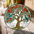 Hummingbird tree of life memorial suncatcher in a bright window with soft daylight