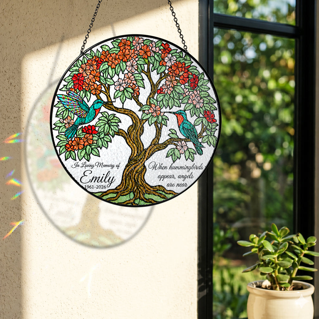 Memorial suncatcher near a window with colorful light reflection on the wall