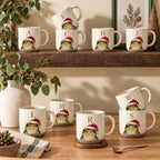 Ten frog pottery mugs, each with a different initial (A, C, E, H, J, L, M, R, S, W), on wooden shelves — one for everyone in the family