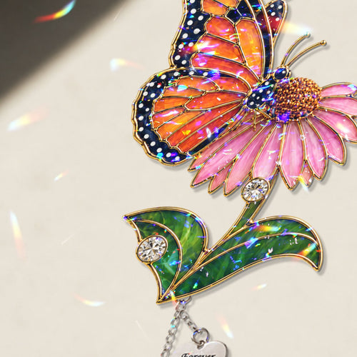 Personalized pink blossom butterfly memorial crystal suncatcher in a window