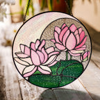 Pink lotus stained glass suncatcher in a bright window with soft daylight