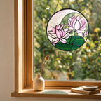 Pink lotus suncatcher in a cozy window with a small vase and soft natural light