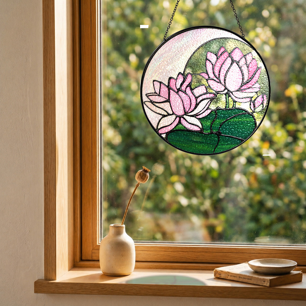 Pink lotus suncatcher in a cozy window with a small vase and soft natural light