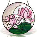 Pink lotus stained glass suncatcher with crescent moon and black frame on a white background